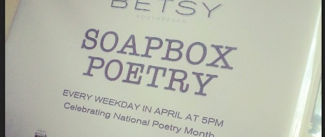 Paper stuck to door that reads soapbox poetry